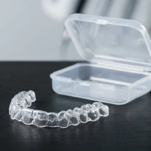 Pair of clear aligners with cases.
