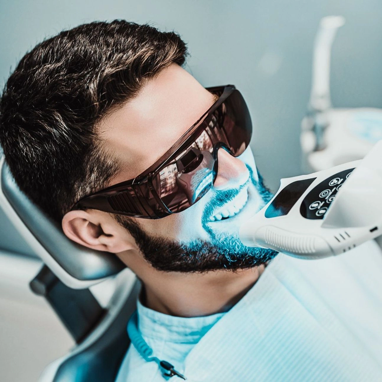 An image of a man going through a teeth whitening procedure