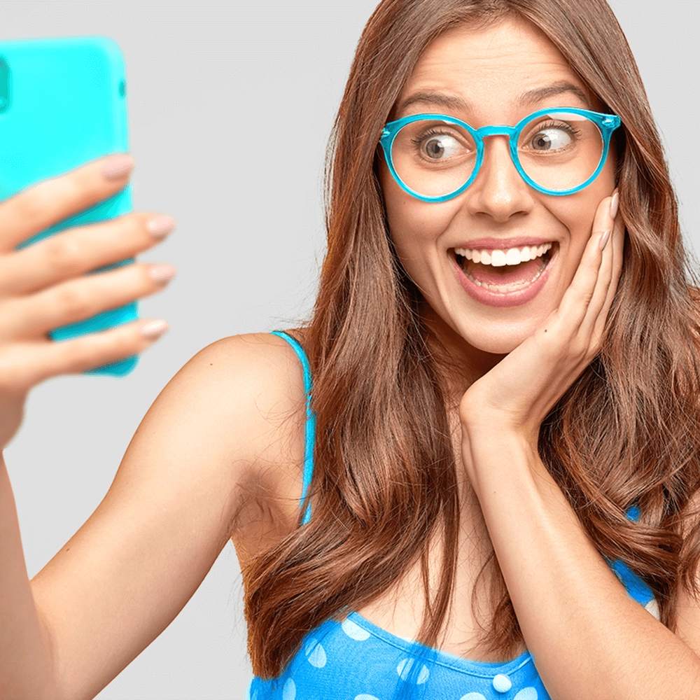 Lady wearing eyeglasses taking a selfie