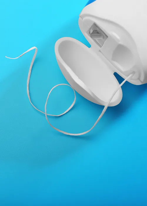 Dental floss on blue background